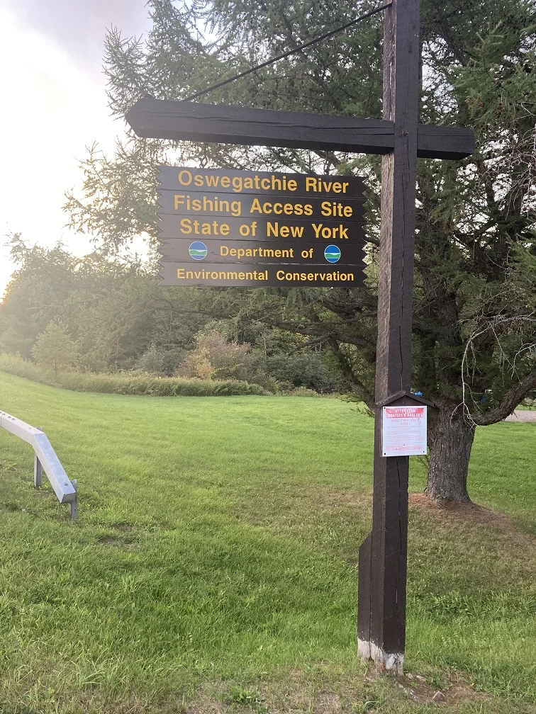 Sign directly on NY-58 at the fishing access spot