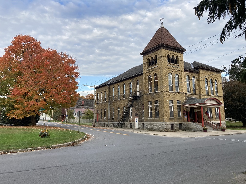 Photograph of the town of Antwerp Town Hall taken by the author in 2022.  The photograph was taken in the fall, which is illustrated by the beautifully colored leaves on a maple tree on the corner across the street from the building  